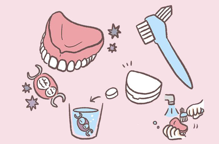 入れ歯のお手入れ方法を示す義歯専用ブラシと義歯洗浄剤のイラスト